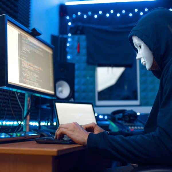 Hacker in mask and hood, account hacking