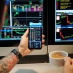 Trader Checking Shares Prices via App