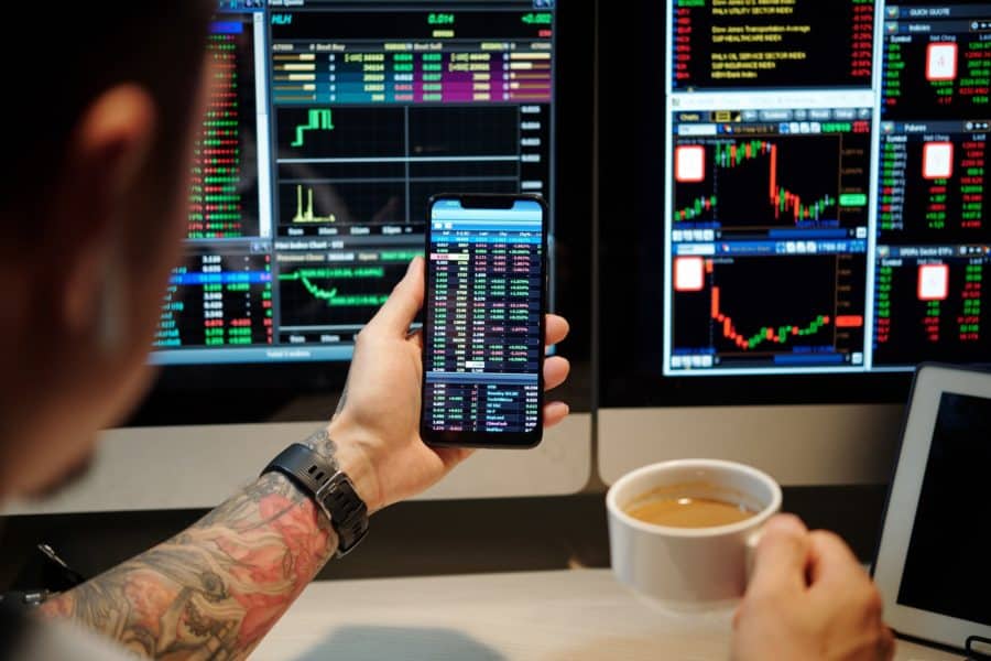 Trader Checking Shares Prices via App